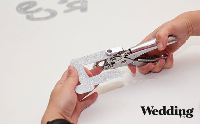 проделать в буквах отверстия