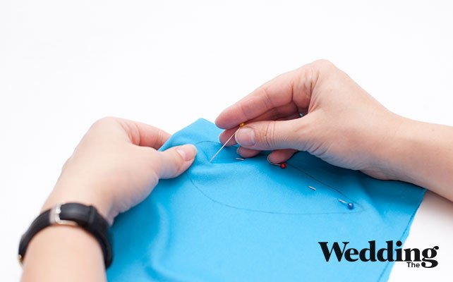 закрепить ткань булавками